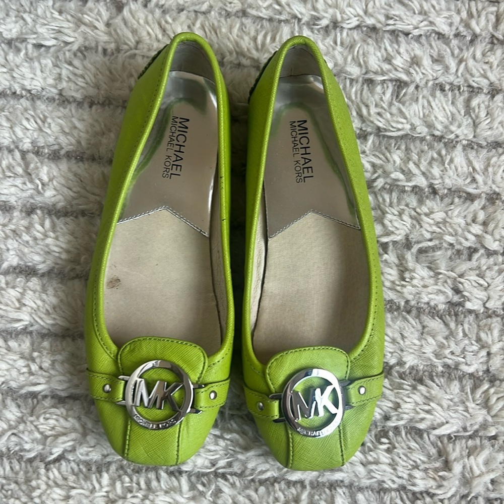 Flat Michael Kors shoes.